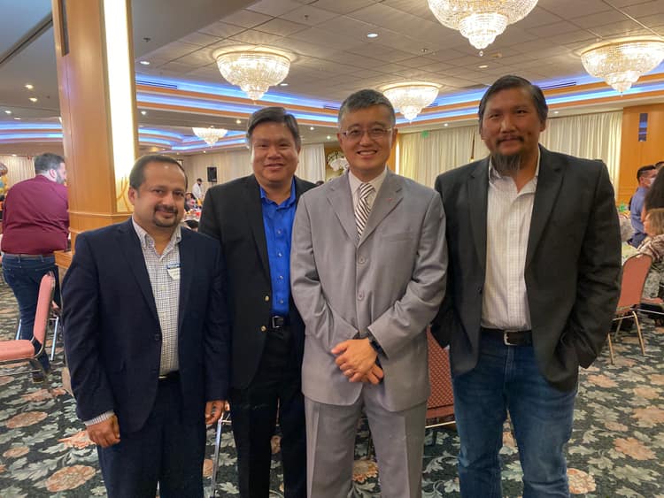 Satheesh Madhathil with community leaders at an evening reception