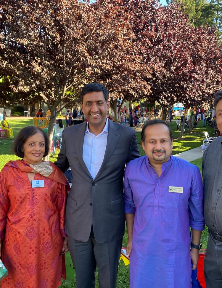Satheesh Madhathil with community members and officials at an outdoor cultural festival