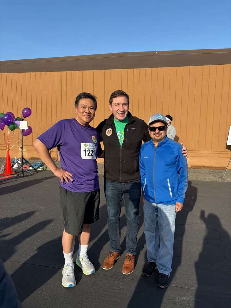 Satheesh Madhathil at a community run supporting local schools